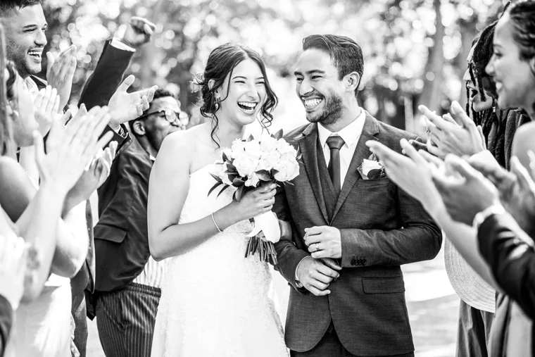 Bride and groom celebrating with guests