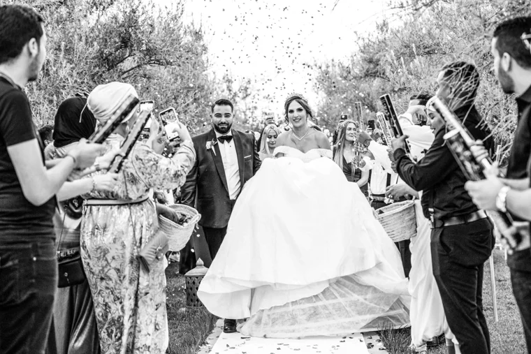 Guests celebrating a couple with confetti