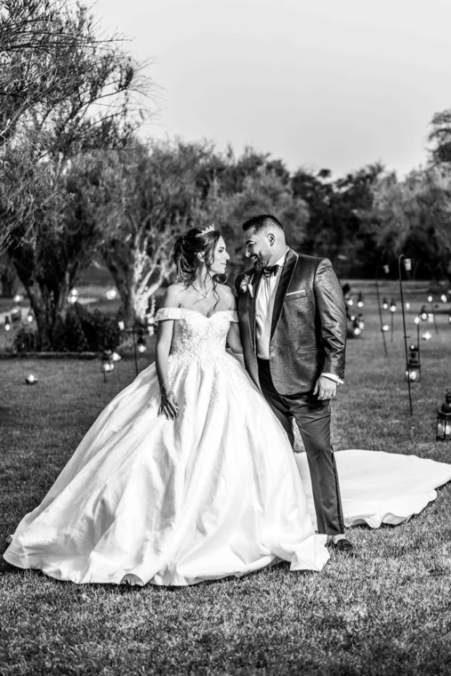 Wedding couple in a garden at dusk
