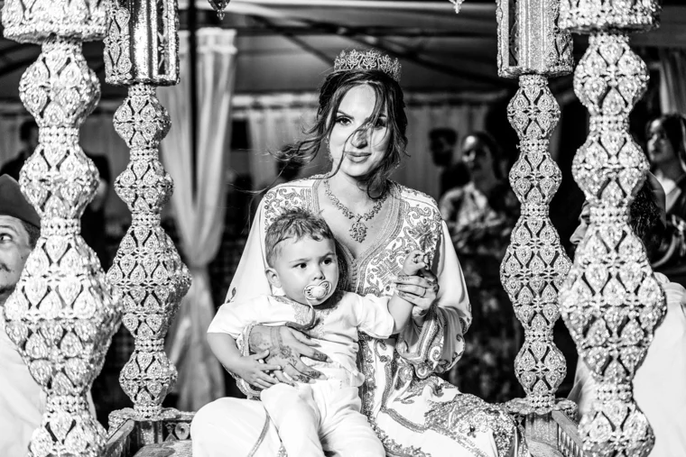 Wedding guest holding a baby