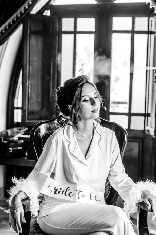 Bride getting ready beside a window