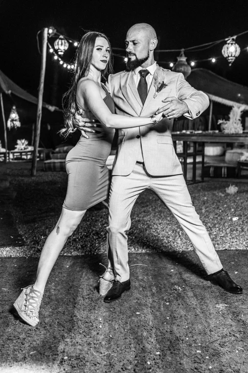 Couple dancing at an evening wedding reception