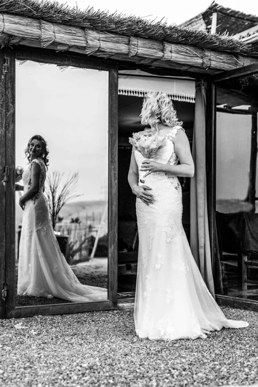 Bride reflected in a mirror during preparations