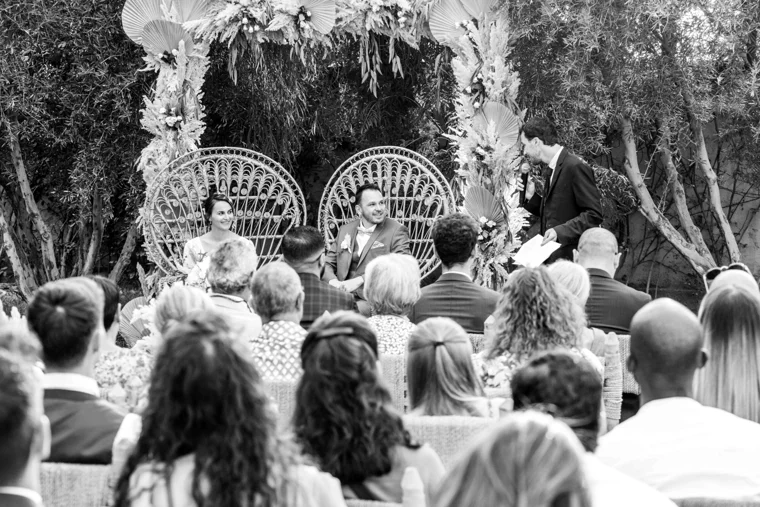 Guests seated for an outdoor wedding ceremony