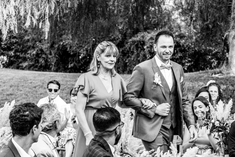 Groom walking with a wedding guest